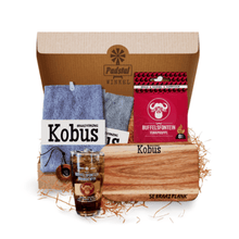 Load image into Gallery viewer, Gift box containing 1 Personalised Braai Plank (39cm x 16cm including handle) 1 Buffelsfontein Brandy Glass, 2 Microfibre Braai Cloths, 1 Buffelsfontein Fire Lighters