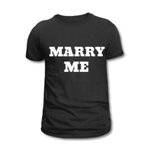Load image into Gallery viewer, A black crew neck t-shirt with the text 'MARRY ME' printed in white on the front.
