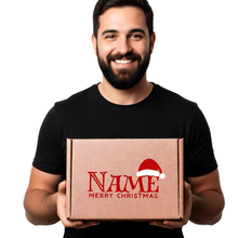 Load image into Gallery viewer, Man holding a personalised gift box with 'Merry Christmas' and personalisation with your name. Gift Packaging.