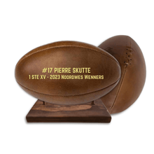 Load image into Gallery viewer, Personalised leather rugby ball with custom branding South Africa handcrafted gift on wooden ball stand.