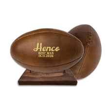 Load image into Gallery viewer, Personalised leather rugby ball with custom branding South Africa handcrafted gift on wooden ball stand.