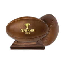 Load image into Gallery viewer, Personalised leather rugby ball with custom branding South Africa handcrafted gift on wooden ball stand.
